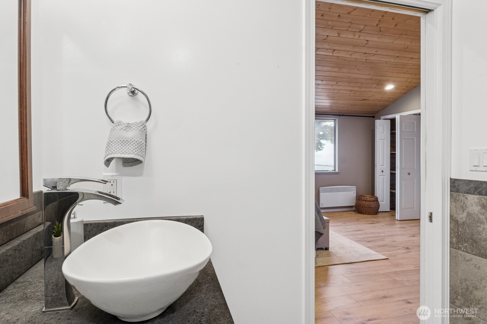 71 Quinault Loop Port Townsend, WA 98368 - Photo 22 of 29 a view of a room with wooden floor and cabinet