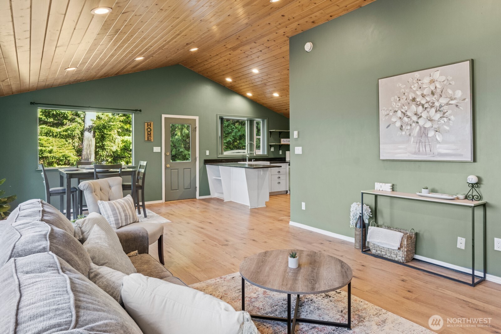 71 Quinault Loop Port Townsend, WA 98368 - Photo 7 of 29 a living room with furniture and a kitchen appliance view
