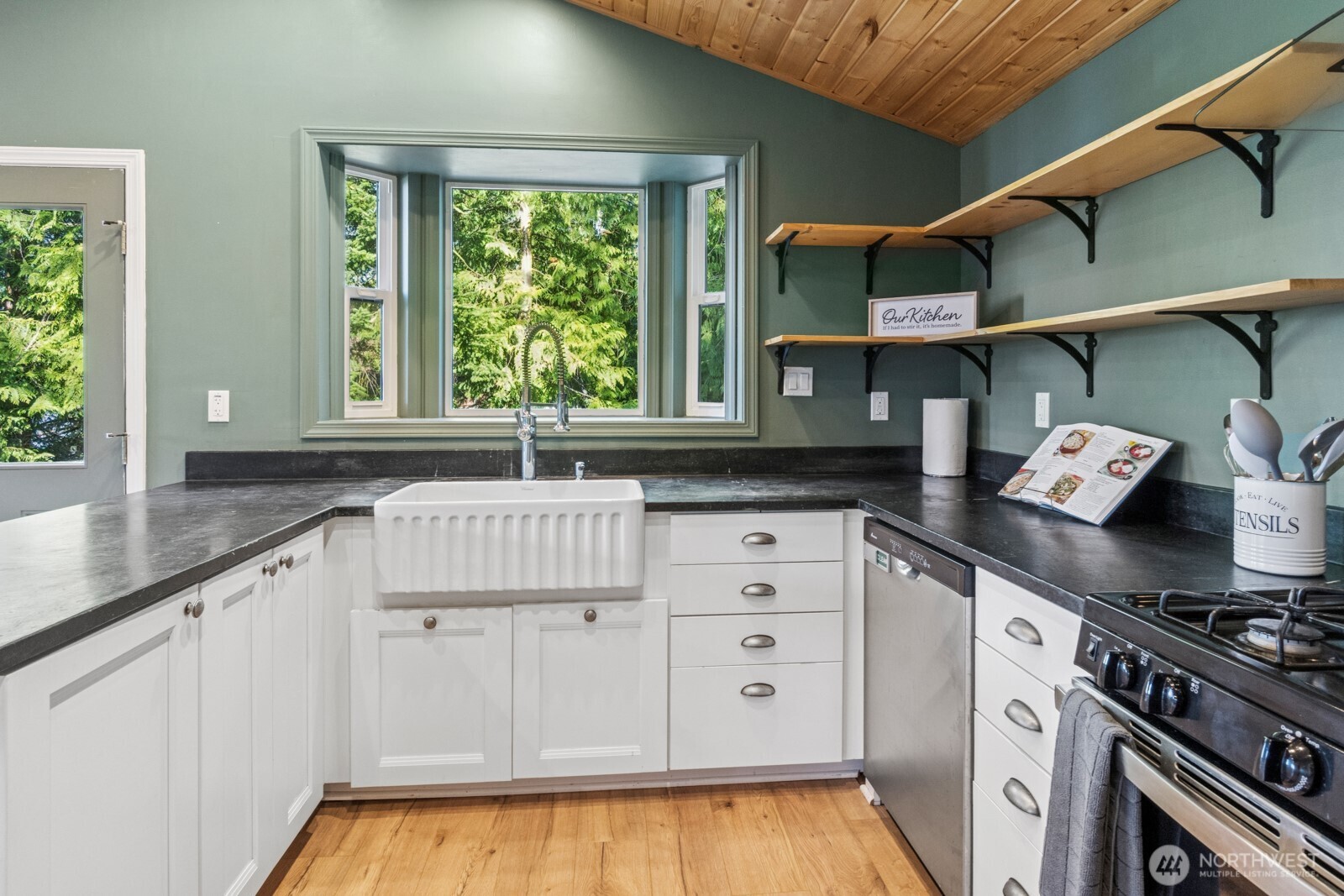 71 Quinault Loop Port Townsend, WA 98368 - Photo 9 of 29 a kitchen with white cabinets and a window