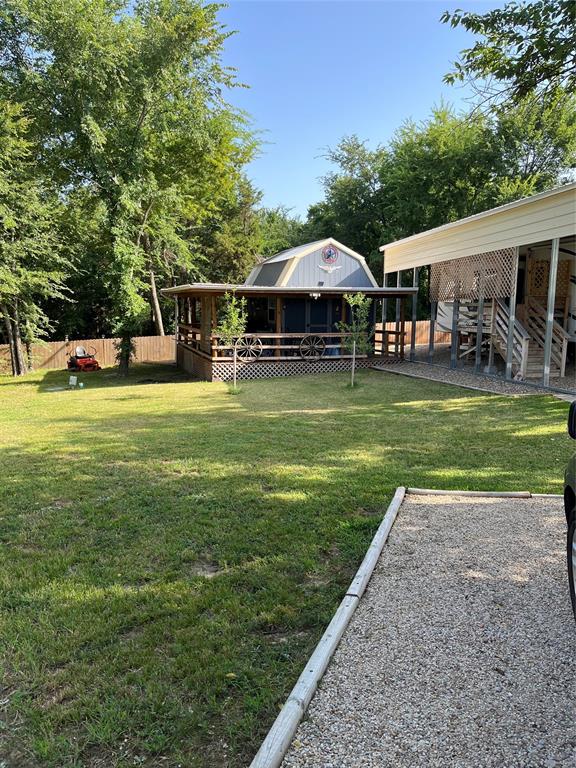 615 Waterfront Row Quitman, TX 75783 - Photo 5 of 7 a view of a house with a yard and sitting area