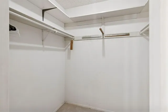 a view of a room with racks on the wall