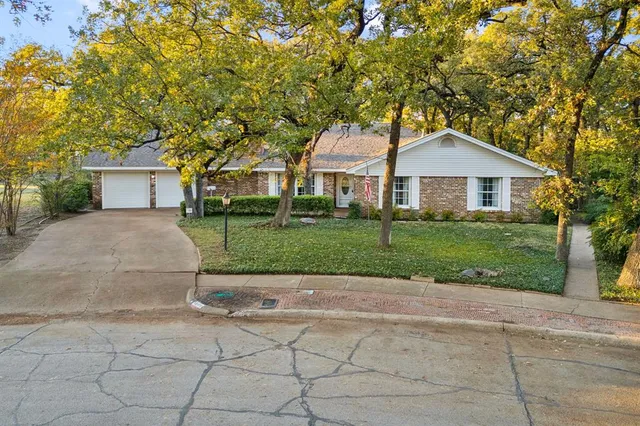 a front view of a house with yard