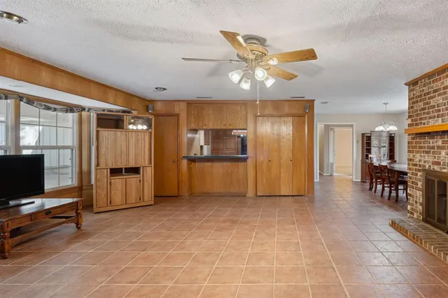 a view of a livingroom with furniture and a flat screen tv