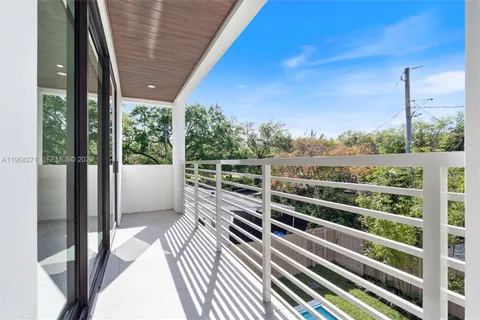a view of a balcony with chairs