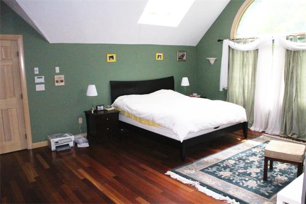 50 Strawberry Lane Canton, MA 02021 - Photo 18 of 28 a bedroom with a bed and wooden floor