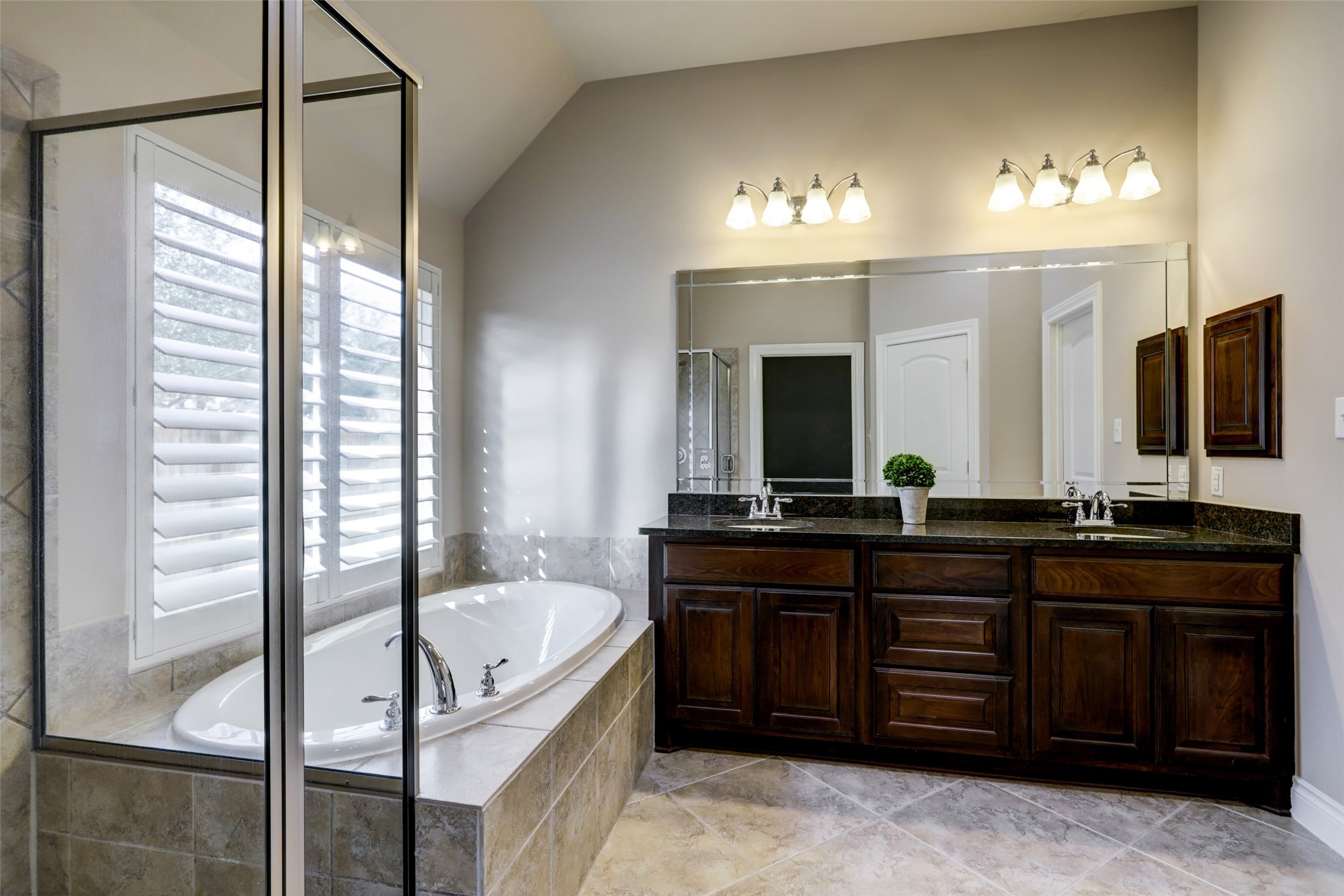 13506 Breakwater Path Loop Houston, TX 77044 - Photo 19 of 42 Spacious primary en-suite with double vanity and separate shower/tub.
