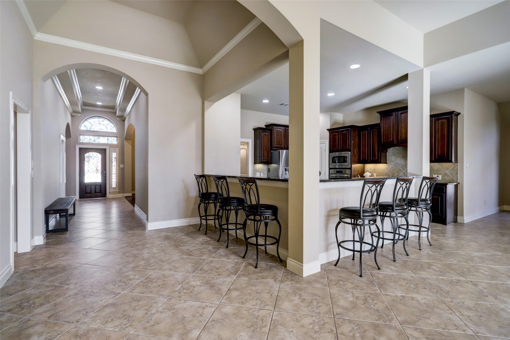 13506 Breakwater Path Loop Houston, TX 77044 - Photo 7 of 42 View of the foyer and kitchen from the living room.