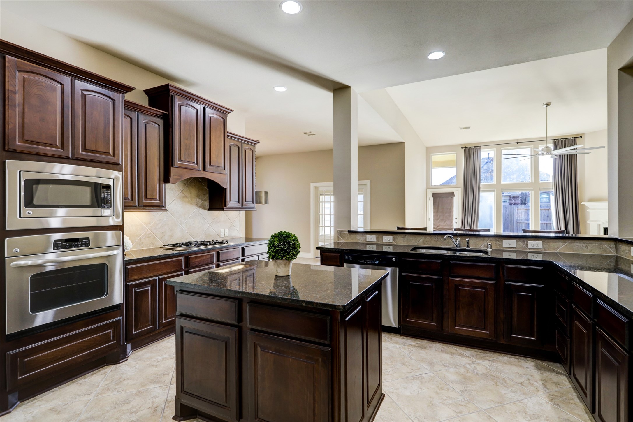 13506 Breakwater Path Loop Houston, TX 77044 - Photo 8 of 42 Beautiful kitchen with plenty of cabinet and counter space.