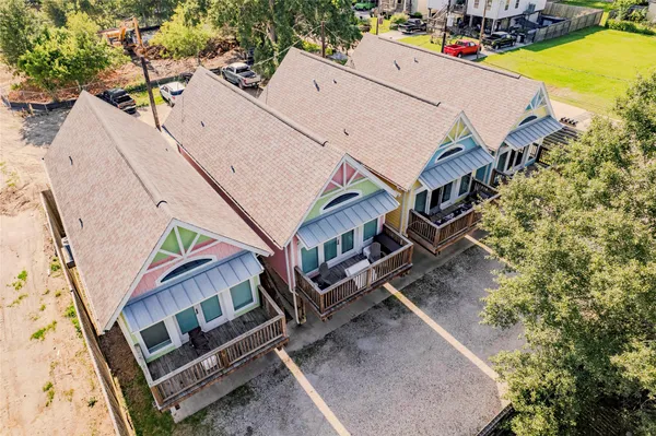 an aerial view of a house with a yard