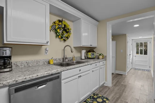 a kitchen with sink and cabinets