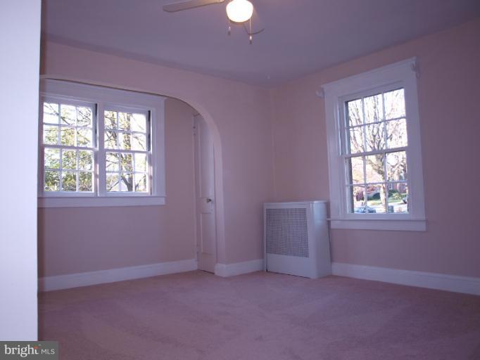 520 Wilton Road Towson, MD 21286 - Photo 1 of 13 an empty room with windows and closet