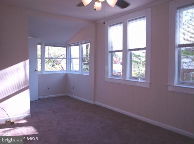 520 Wilton Road Towson, MD 21286 - Photo 2 of 13 an empty room with a window