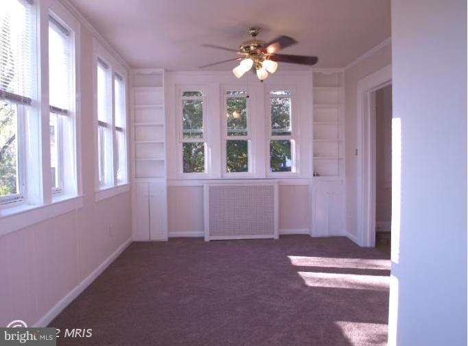 520 Wilton Road Towson, MD 21286 - Photo 5 of 13 a view of an empty room with a window