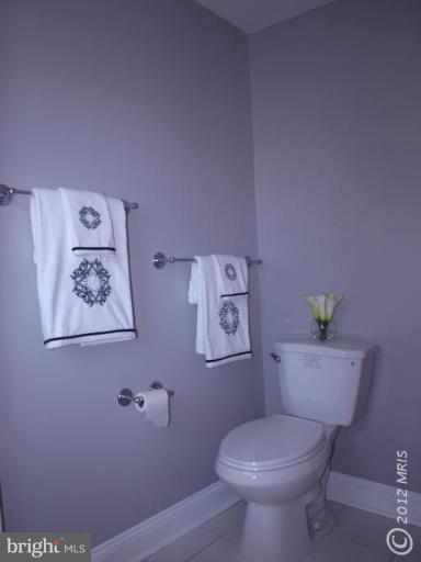 520 Wilton Road Towson, MD 21286 - Photo 6 of 13 a white toilet sitting next to a bathroom sink