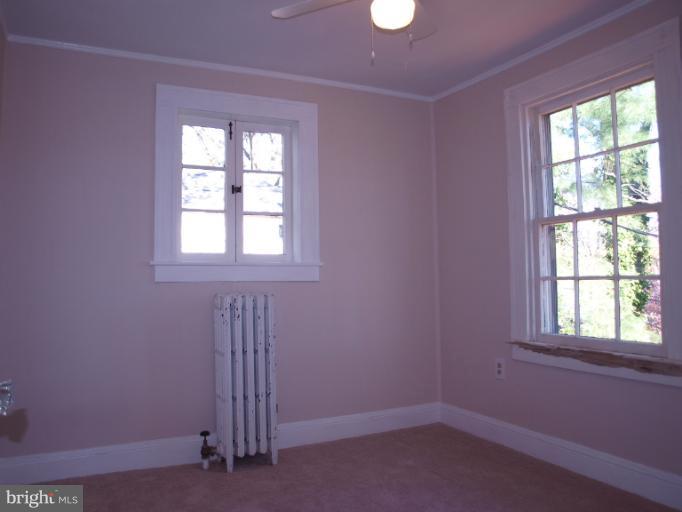 520 Wilton Road Towson, MD 21286 - Photo 7 of 13 an empty room with a window