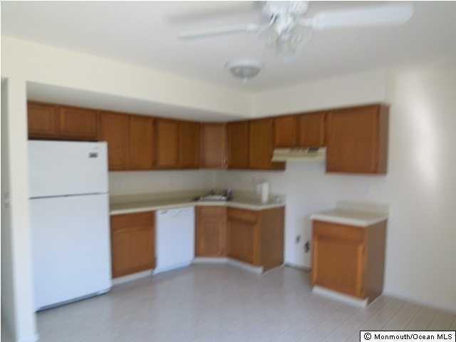 1080 Sawmill Road Brick, NJ 08724 - Photo 3 of 3 a kitchen with stainless steel appliances granite countertop a refrigerator a stove a sink and a microwave