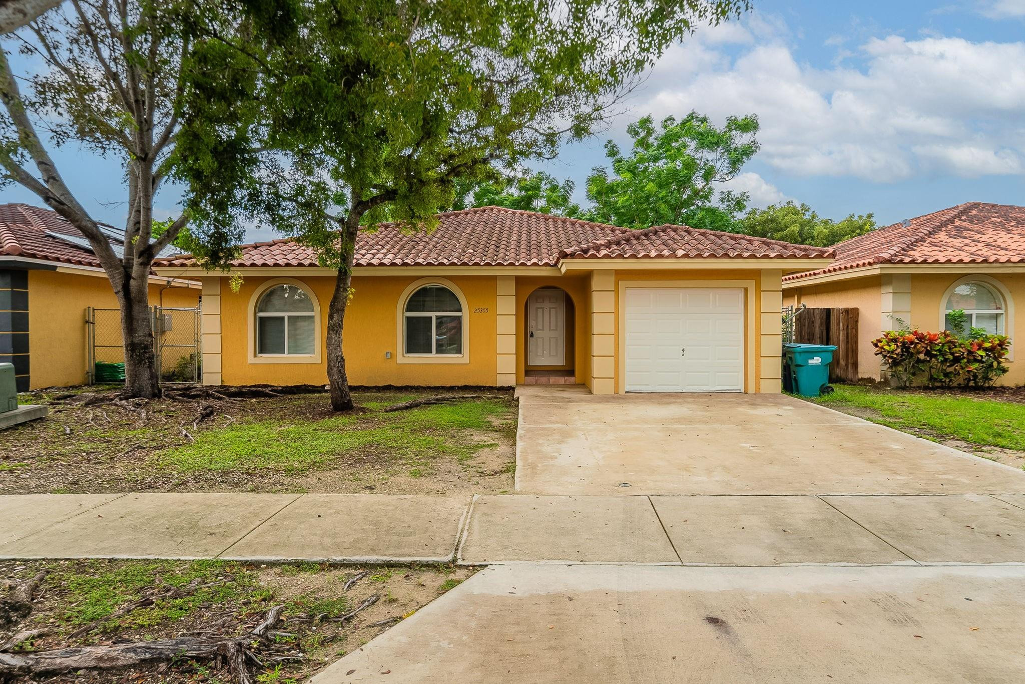 25355 Southwest 135th Court Homestead, FL 33032 - Photo 1 of 40 a house view with a garden space