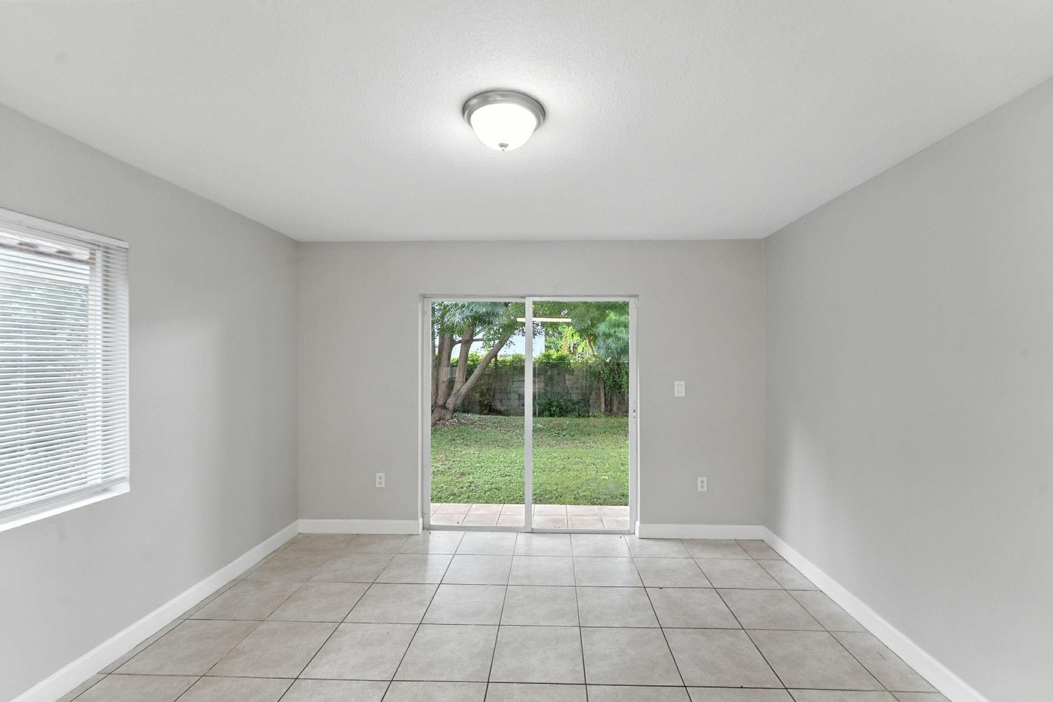 25355 Southwest 135th Court Homestead, FL 33032 - Photo 12 of 40 a view of an empty room with a window