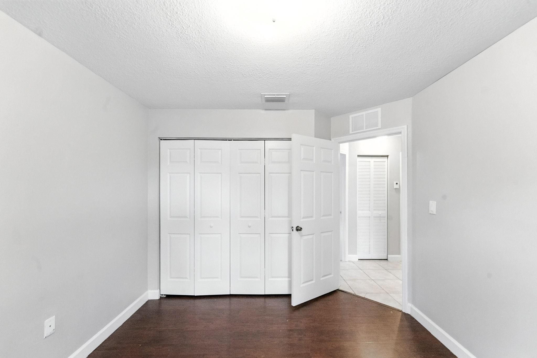 25355 Southwest 135th Court Homestead, FL 33032 - Photo 23 of 40 a view of room with hardwood floor