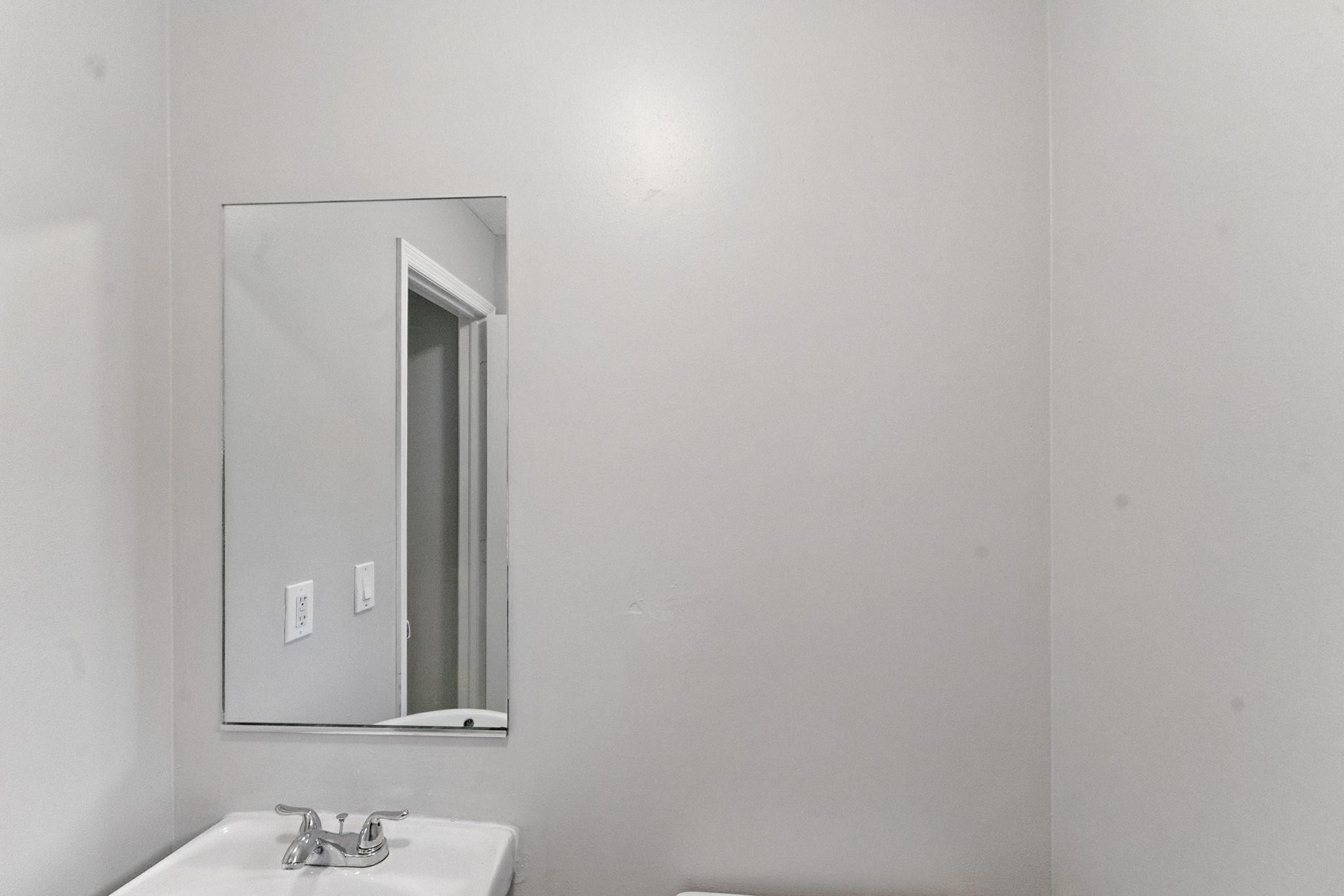 25355 Southwest 135th Court Homestead, FL 33032 - Photo 28 of 40 a bathroom with a sink and a mirror