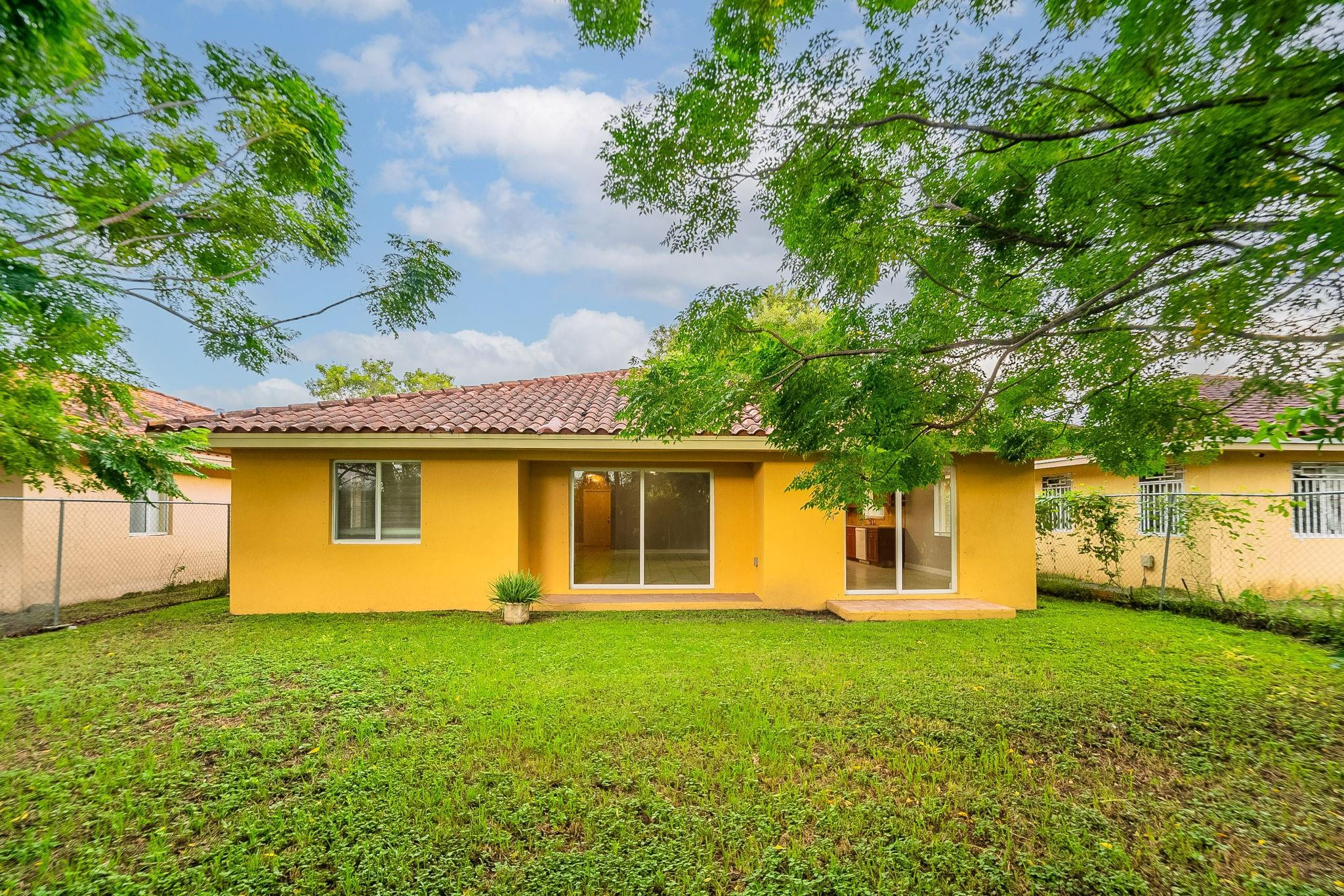 25355 Southwest 135th Court Homestead, FL 33032 - Photo 35 of 40 front view of a house with a yard