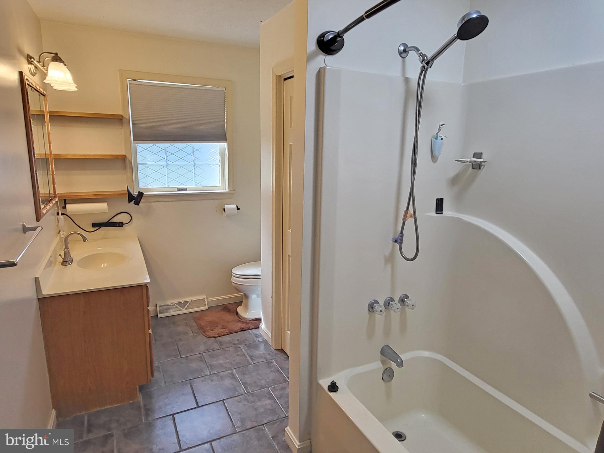 212 Walnut Dale Road Shippensburg, PA 17257 - Photo 23 of 56 a bathroom with a sink a toilet and shower