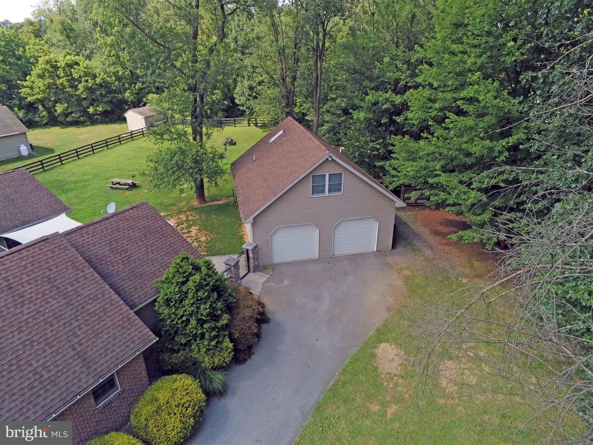 212 Walnut Dale Road Shippensburg, PA 17257 - Photo 35 of 56 a view of a house with a yard and large trees