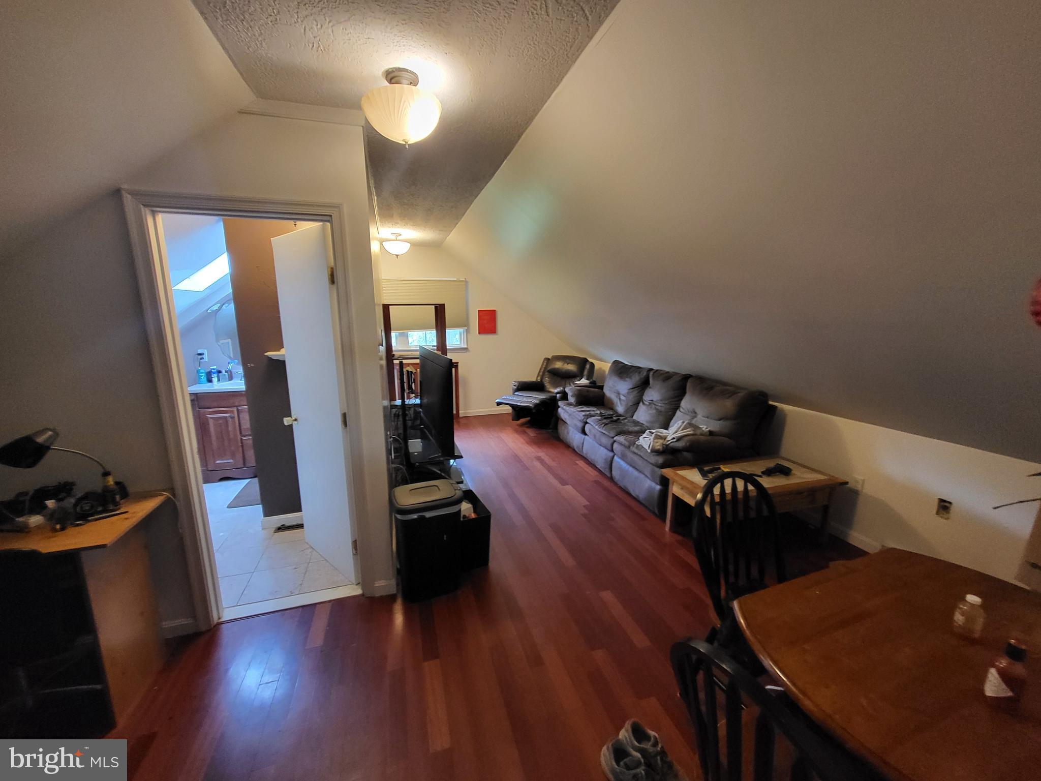 212 Walnut Dale Road Shippensburg, PA 17257 - Photo 40 of 56 a living room with furniture and a wooden floor