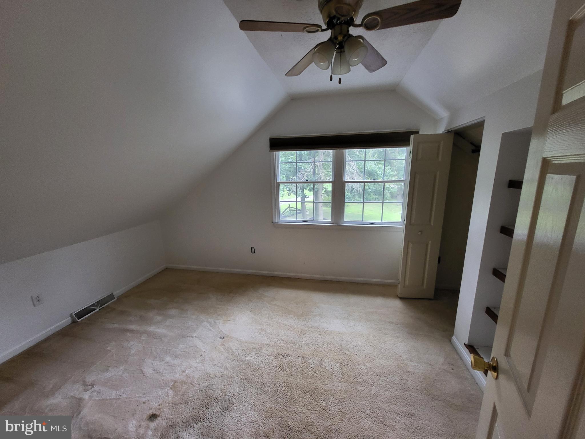 212 Walnut Dale Road Shippensburg, PA 17257 - Photo 41 of 56 an empty room with a window and ceiling fan