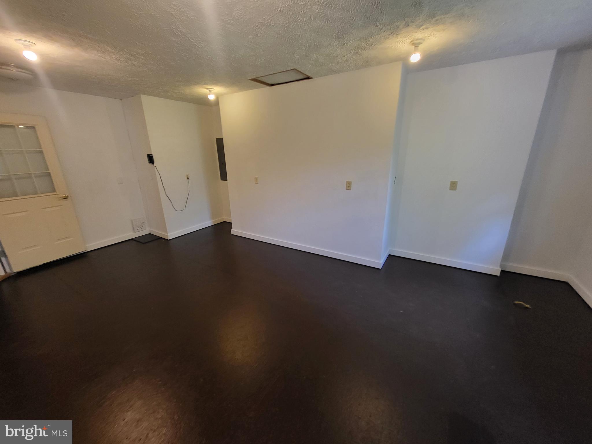 212 Walnut Dale Road Shippensburg, PA 17257 - Photo 51 of 56 an empty room with wooden floor and windows