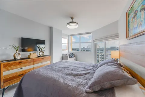 a living room filled with furniture and a window