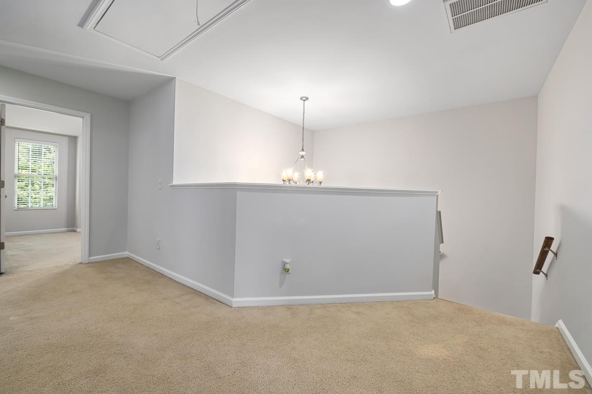 3739 Burtons Barn Street Raleigh, NC 27610 - Photo 21 of 42 an empty room with windows
