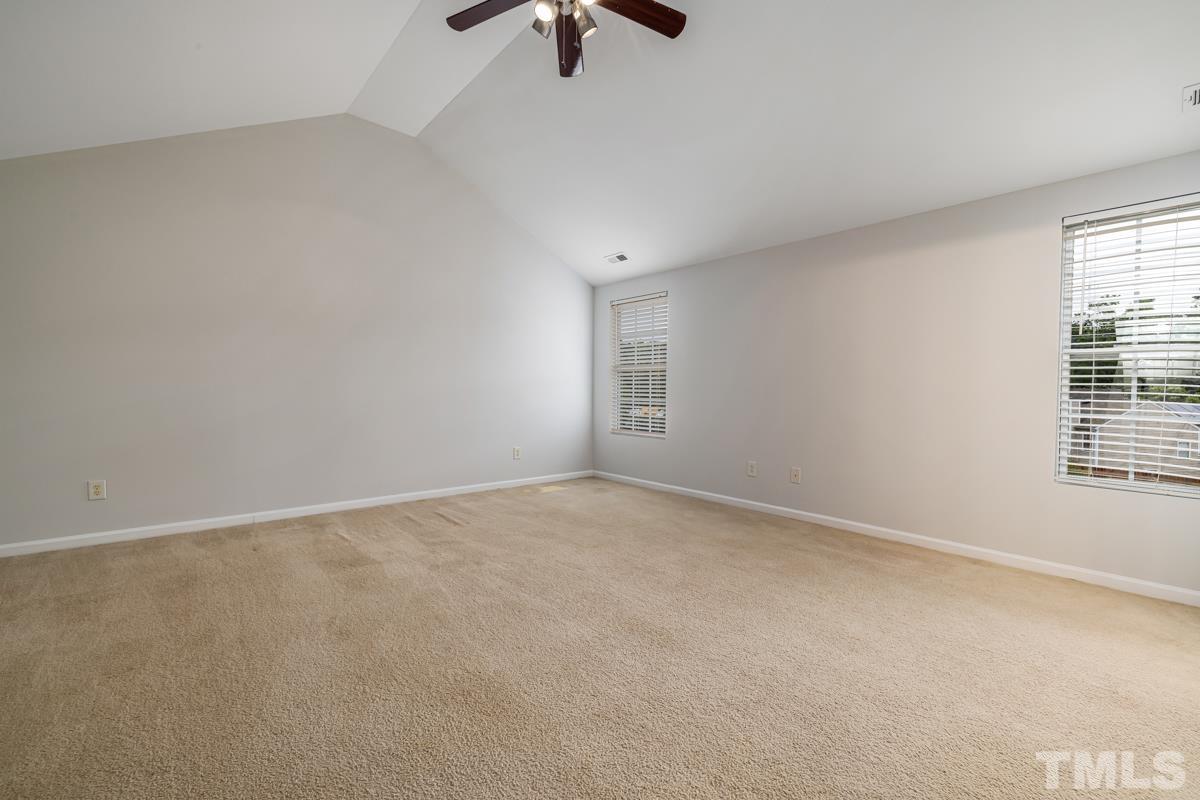 3739 Burtons Barn Street Raleigh, NC 27610 - Photo 26 of 42 wooden floor in an empty room with a window