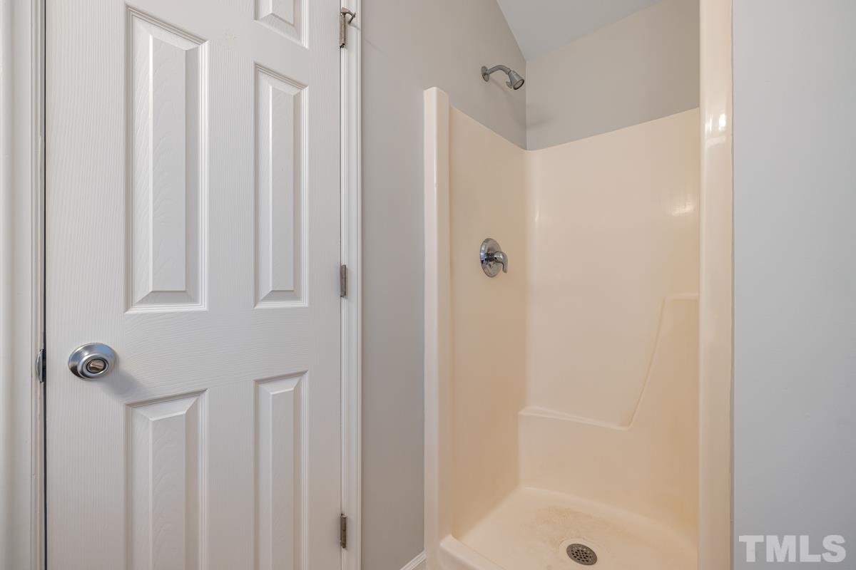 3739 Burtons Barn Street Raleigh, NC 27610 - Photo 31 of 42 a bathroom with a shower