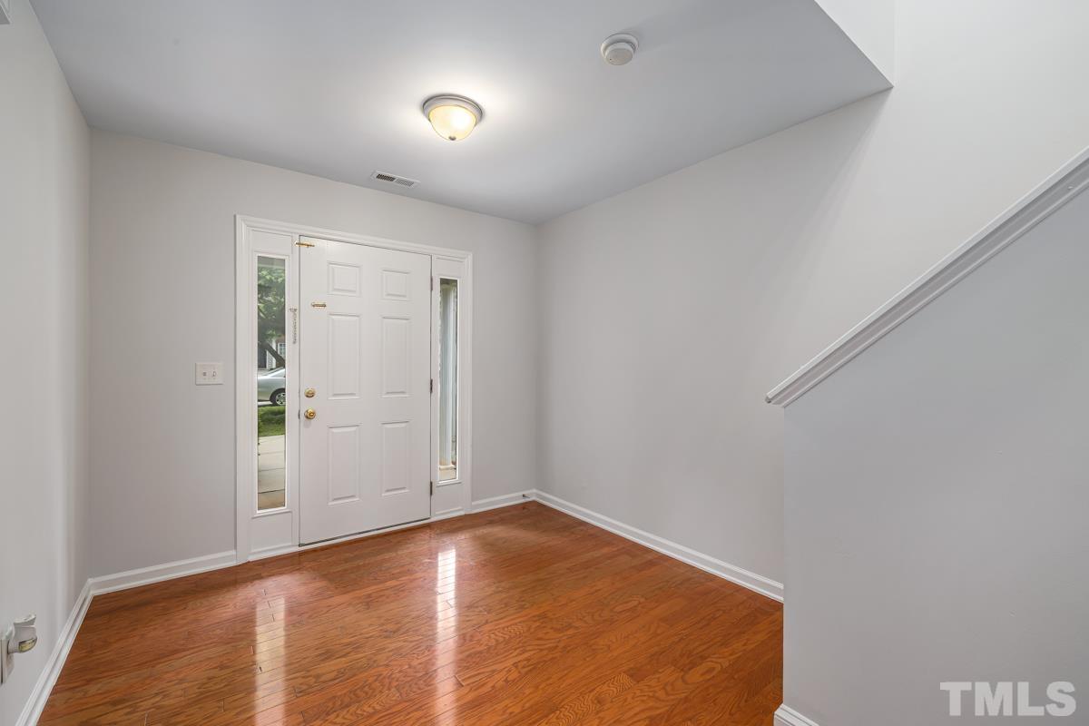 3739 Burtons Barn Street Raleigh, NC 27610 - Photo 6 of 42 an empty room with windows