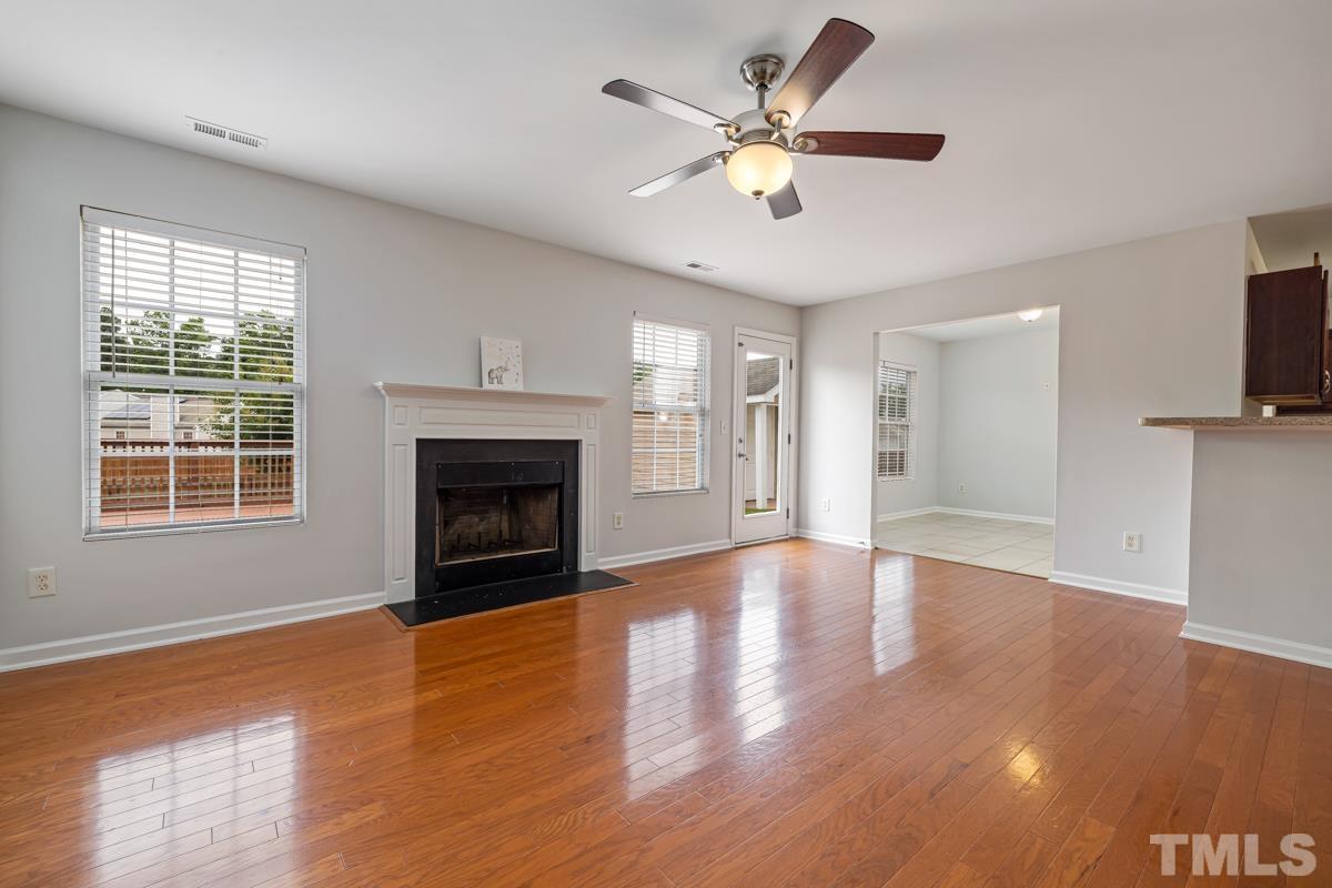 3739 Burtons Barn Street Raleigh, NC 27610 - Photo 9 of 42 a view of an empty room with wooden floor and a window