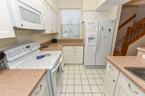 a living room with furniture and flat screen tv