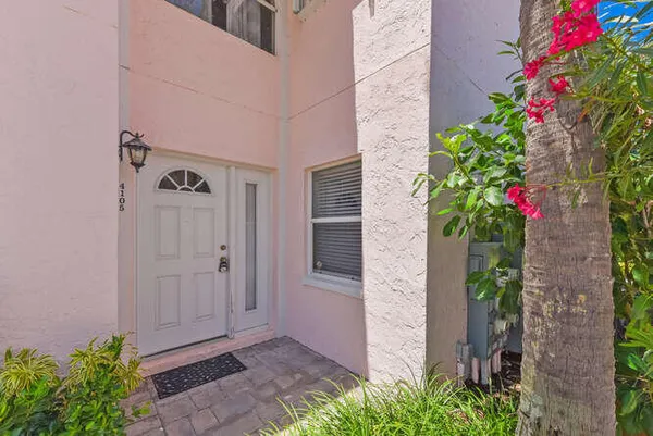 a view of a house with a flower garden