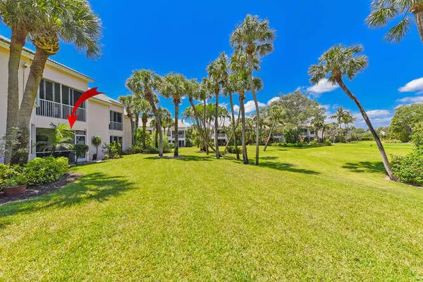 a swimming pool with outdoor seating and yard