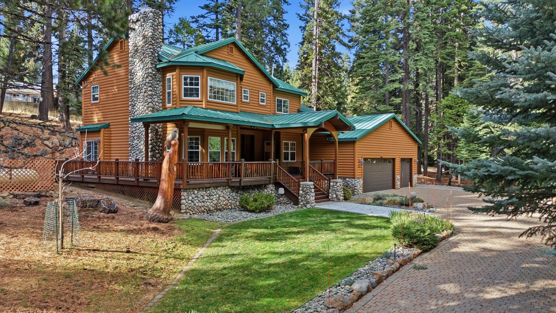 1017 Timber Ridge Road Lake Almanor, CA 96137 - Photo 1 of 45 a front view of a house with garden