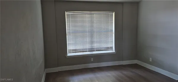 a kitchen with sink cabinets and window