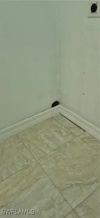 a kitchen with granite countertop wood cabinets stainless steel appliances a sink and window