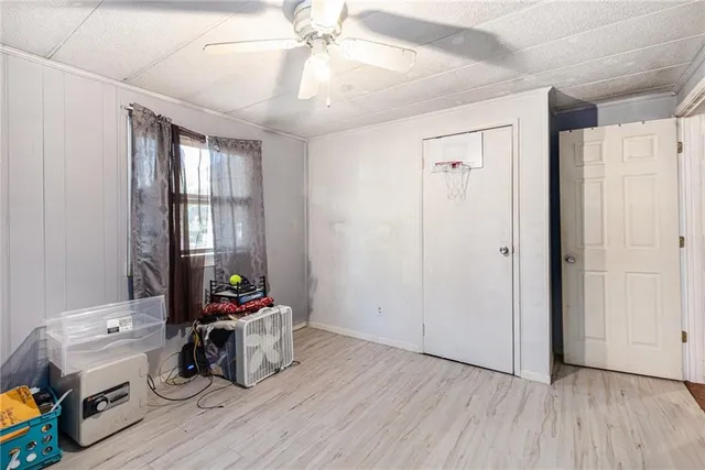a view of a livingroom with furniture and hardwood floor