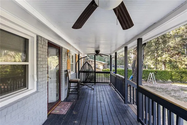 a view of balcony with wooden floor