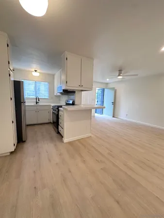 a view of a kitchen with a sink