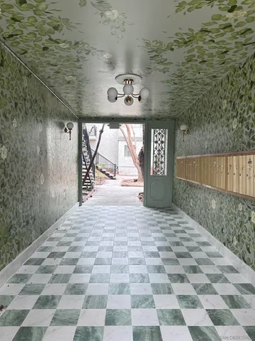 a view of a front door of a house with stairs