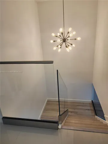 a view of a room with window and a ceiling fan