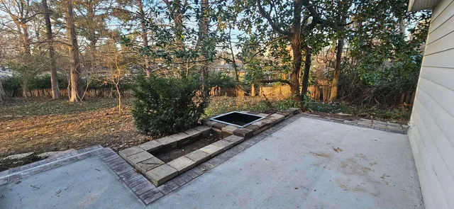 a view of a yard with trees