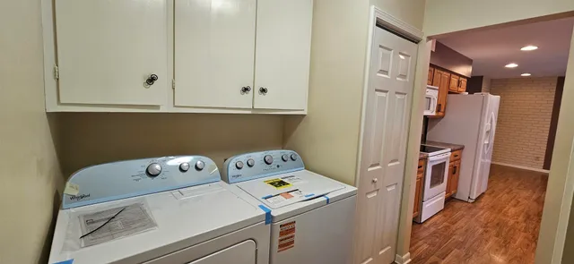 a view of kitchen with furniture and wooden floor