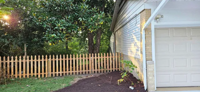 a view of a wooden fence